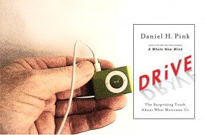 image of hand holding an iPod and the book DRIVE 